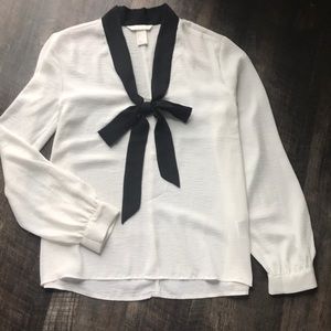 White dress shirt with black tie neckline